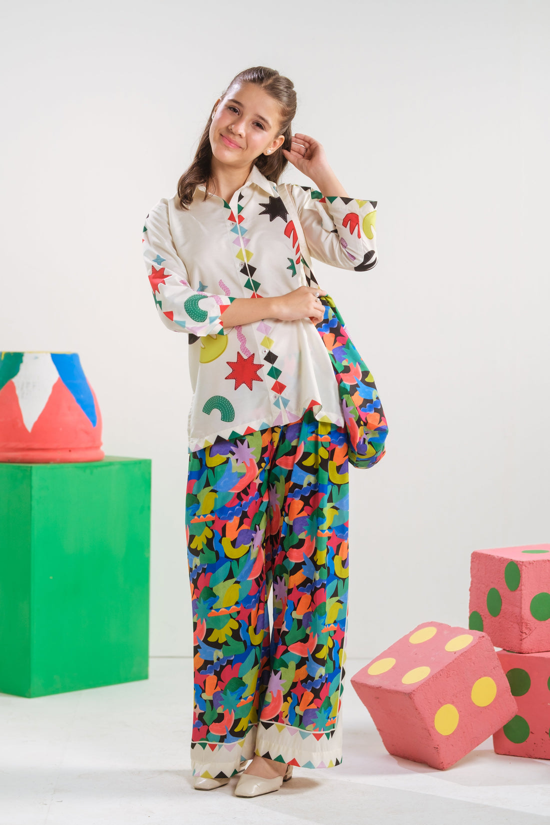 Girl wearing the Celestial Doodle two-piece ready-to-wear outfit by Sprinkles Pakistan