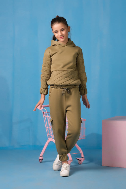 Girl wearing a hooded top with quilted panels and matching jogger pants