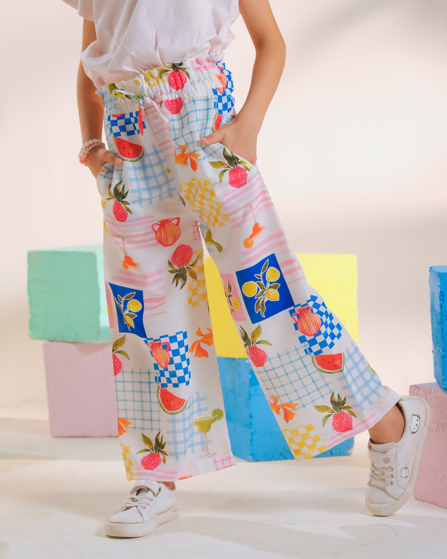 Girl wearing Fruit Fiesta wide-leg printed trousers from Sprinkles Pakistan